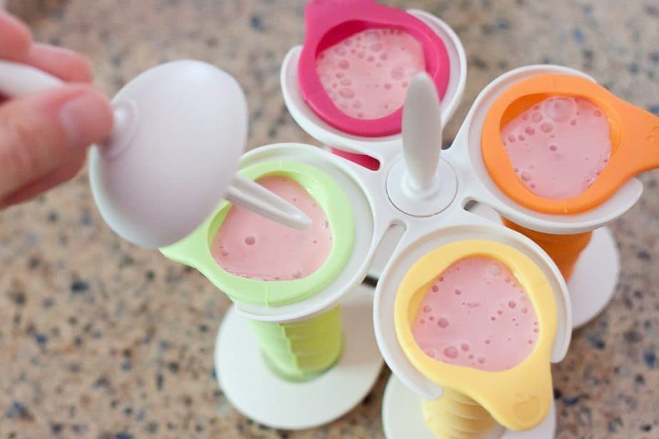 These Strawberry Greek Yogurt Popsicles are a healthy and refreshing frozen treat that everyone will look forward to on a hot summer day.