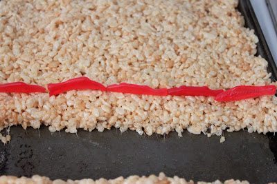 Rice crispies with sliced swedish fish at the top.