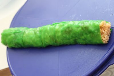 A roll of rice crispies wrapped in a fruit roll-ups. 