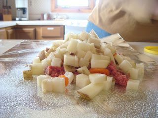 Grind meat with white onion potatoes and carrot in a foil.