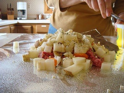 Grind meat with white onion potatoes and carrot in a foil.