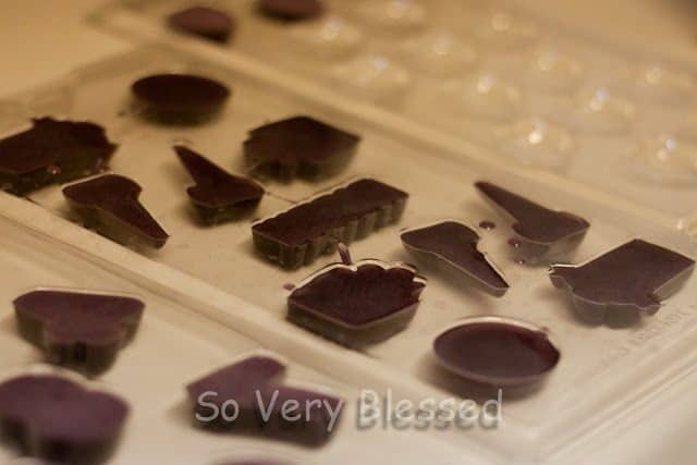 Chocolates molded in different shapes in a molder. 