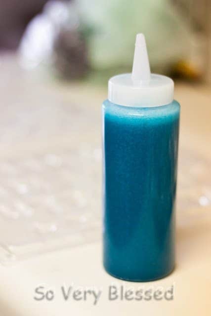 A blue food coloring in a plastic container.