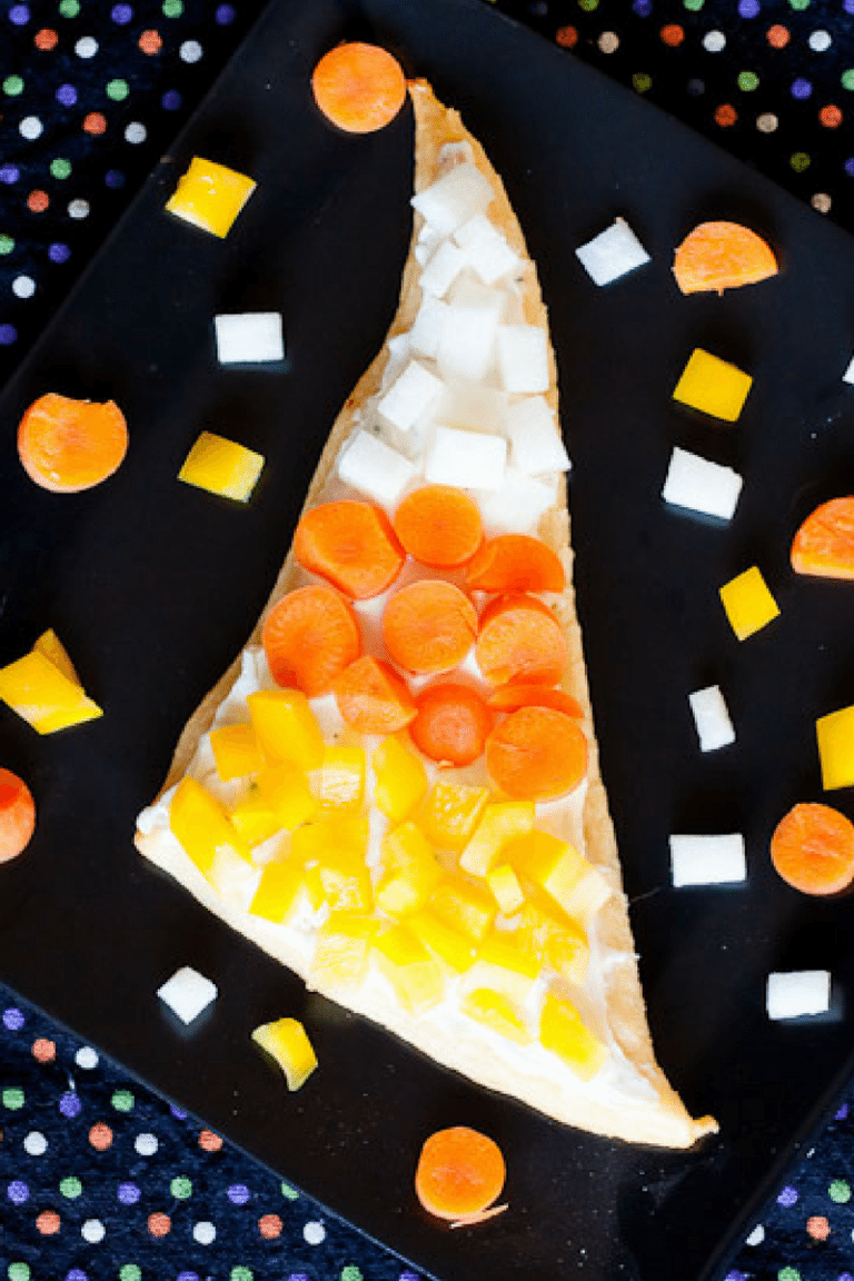 Candy Corn Veggie Pizza Recipe : So Very Blessed – These cute and easy to make veggie pizza slices topped with crunchy fresh vegetables make for a healthy Fall snack, side dish, or party food.