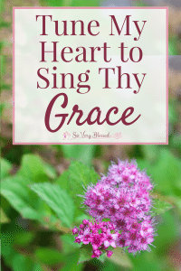 A photo of a violet flower with a text overlay that reads as 'Tune My Heart To Sing Thy Grace': So Very Blessed.
