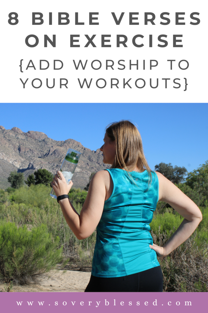 woman in exercise clothes holding her water bottle looking out to the mountains