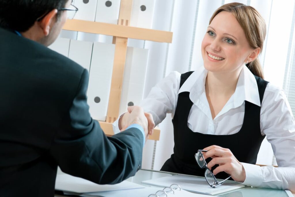 Prayers For A Job Interview - business woman shaking hands at a job interview