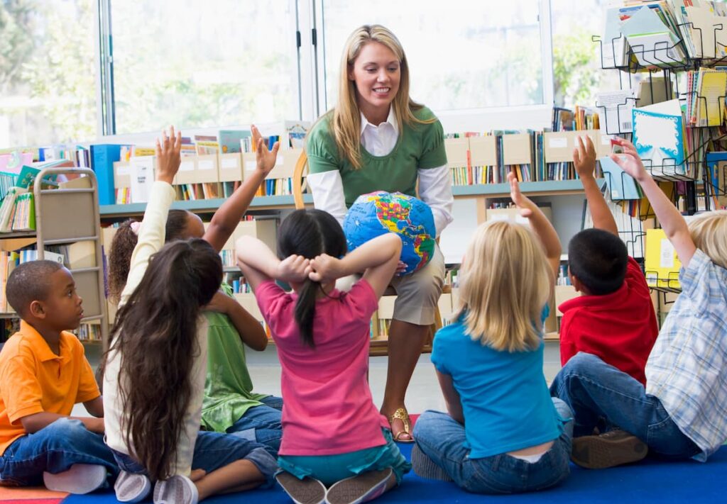 Back To School Prayers for Teachers = kindergarten teacher talking to her students