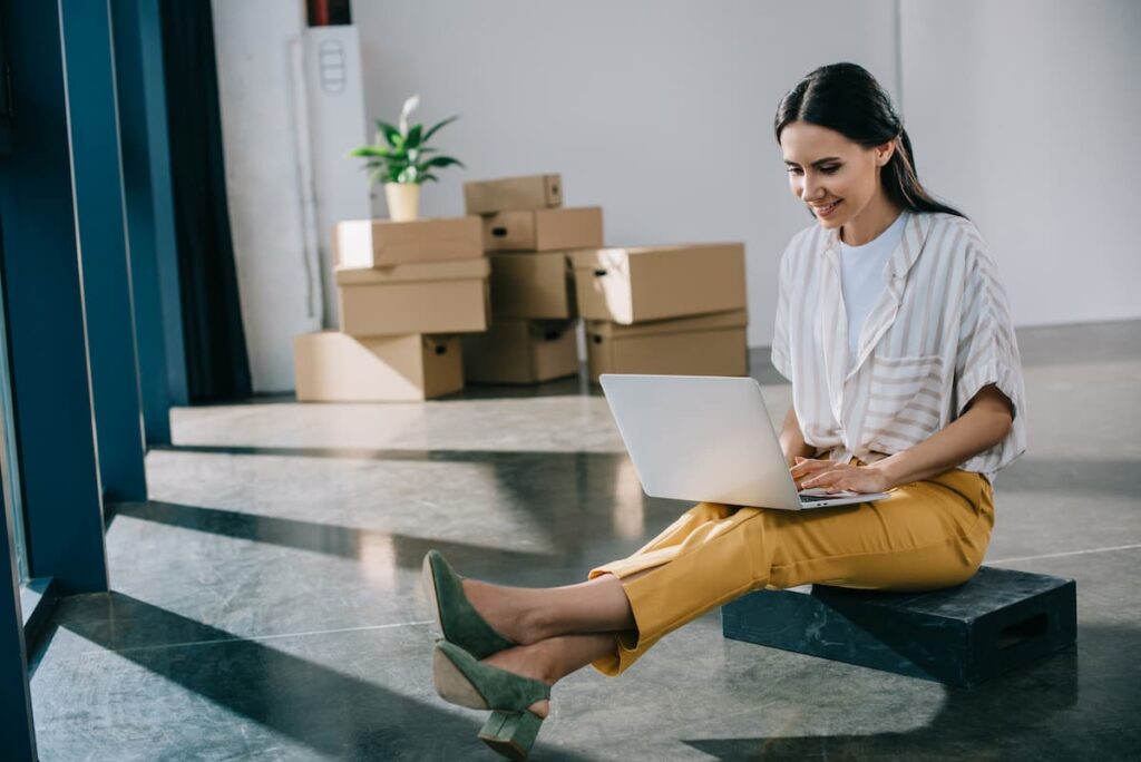 New Job Prayers - woman sitting with computer on her lap in office
