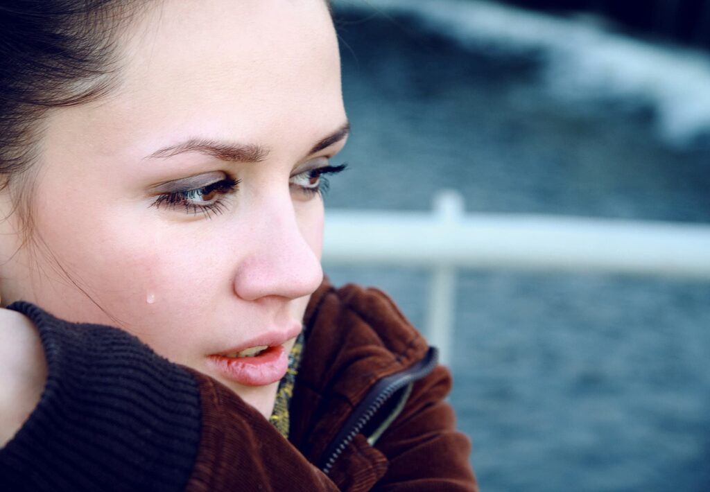 Prayers For Emotional Healing - closeup of woman looking off to the side with tears running down her cheeks