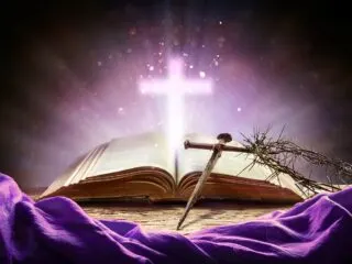 Open bible with glowing cross above, thorn of crowns and ancient nail on a purple background.