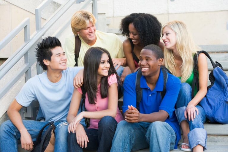 Group of 6 teenagers sitting on a stoop for 13 powerful prayers for teenagers