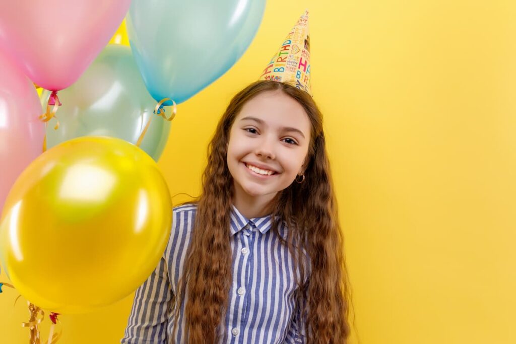 Birthday Prayers For My Niece - Young girl in birthday party with colorful inflatable balloons